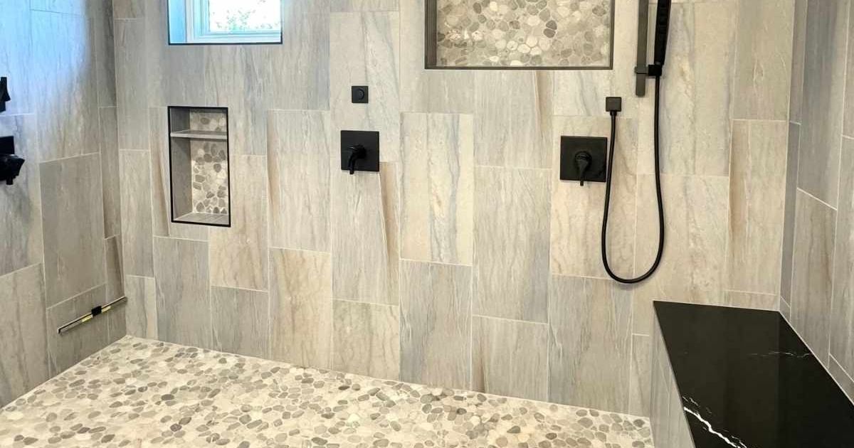 A senior-friendly bathroom remodel in Mesa, Arizona, with a new roll-in shower, complete with grab bars and a non-slip floor to provide safety and support for aging in place.